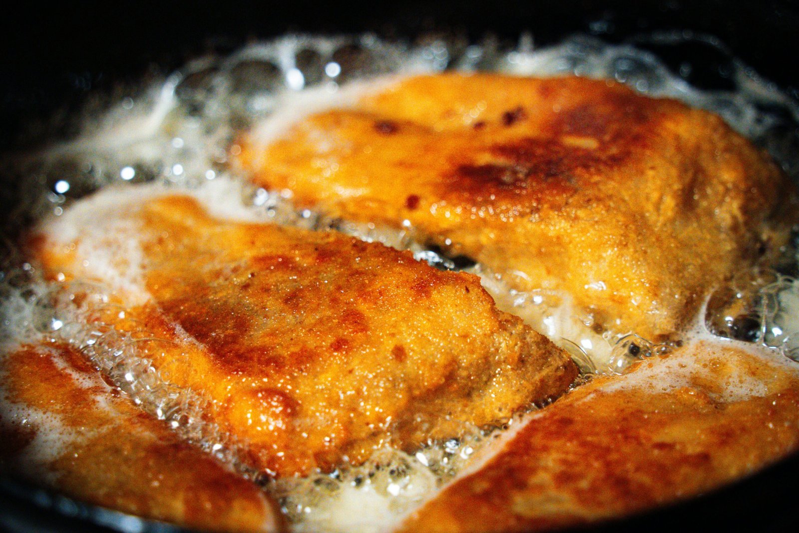 A close up of food cooking in a pan